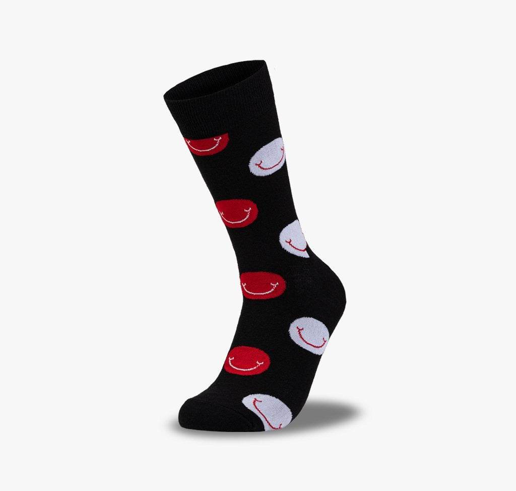Bunte und lustige Smiley Socken für Damen und Herren mit schwarzem Hintergrund und lachenden Gesichtern in rot und weiß